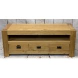 ULTRA-MODERN LIGHT OAK ENTERTAINMENT STAND with central open shelf and three lower drawers, on