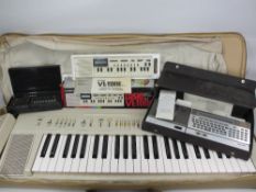 LATE 20TH CENTURY ELECTRONICS GROUP to include a Yamaha portable keyboard in carry case, Sharp CE-