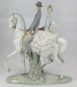 LARGE LLADRO PORCELAIN FIGURAL GROUP of a Spanish couple on horseback, 44cms H, 38cms L