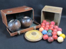 VINTAGE SNOOKER BALLS, wooden discus, hardwood bowling ball (a pair) dated 1951 in a leather