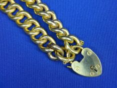 NINE CARAT GOLD CHUNKY CURB LINK BRACELET with large padlock clasp, 23grms