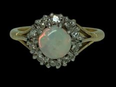 18CT GOLD OPAL & DIAMOND RING SIZE M - 4.2grms, the central opal surrounded by 10 diamonds in an