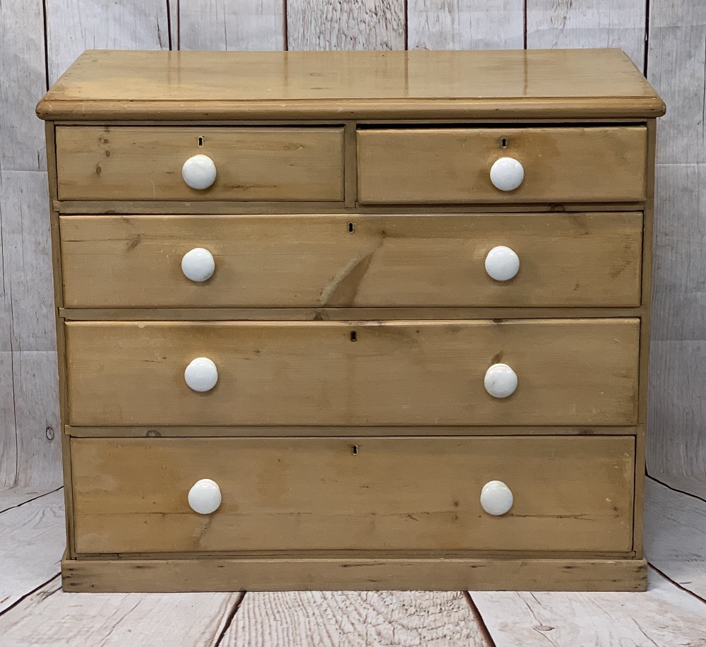 VICTORIAN STRIPPED PINE CHEST of two short over three long drawers with white porcelain knobs, on