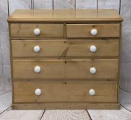 VICTORIAN STRIPPED PINE CHEST of two short over three long drawers with white porcelain knobs, on