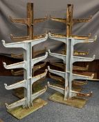 BLACKSMITH'S CAST IRON STOCK RACKS (4) to include two, eight branch examples, 102cms H, 74cms W
