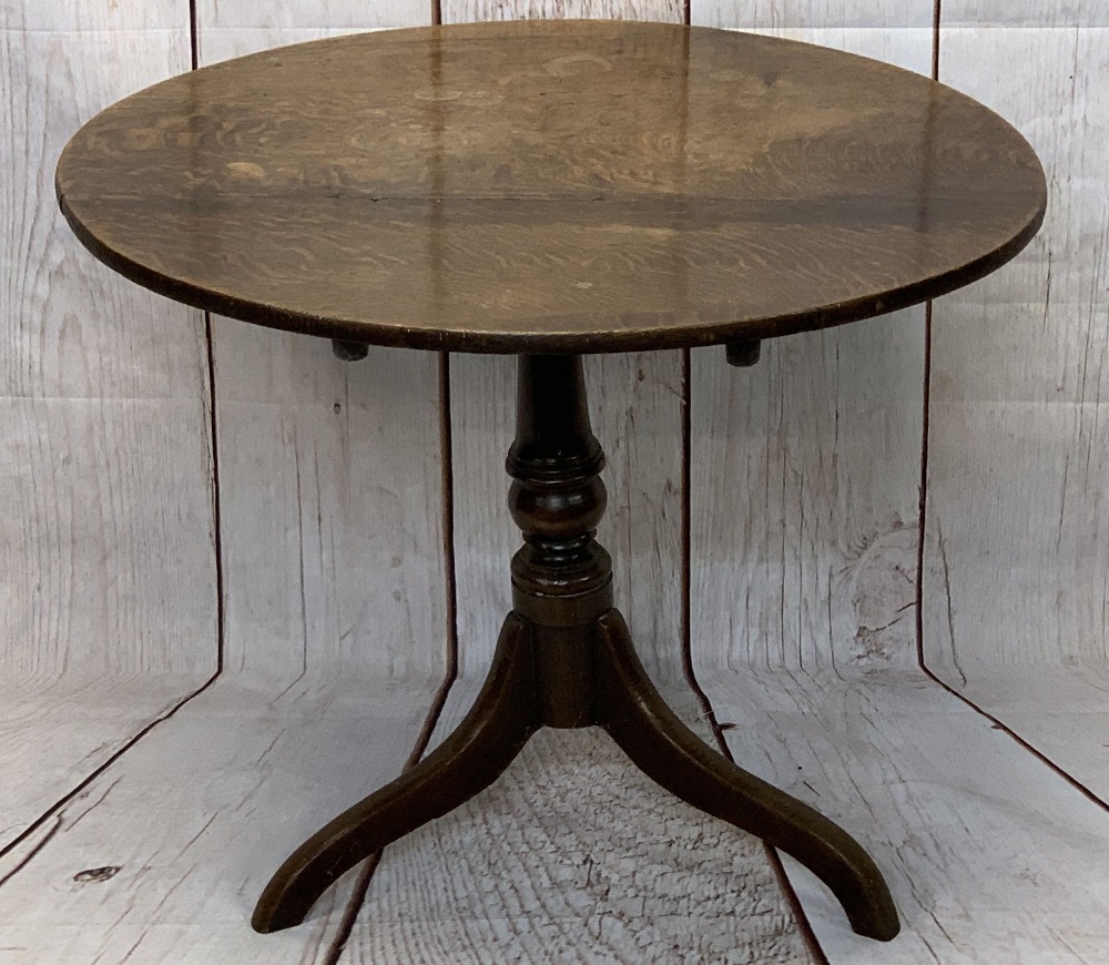 ANTIQUE OAK TILT TOP TRIPOD TABLE, the 82.5cms diameter top on a turned column base with three