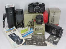 CANNON A1 SLR CAMERA BODY and associated equipment, No 1429361 with original warranty card and