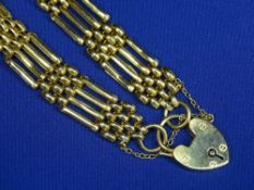 NINE CARAT YELLOW GOLD GATE LINK BRACELET with padlock clasp, 14.2grms