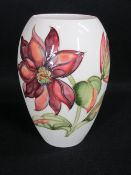 MOORCROFT 'CLEMATIS' VASE, cream ground, 21cms H, impressed marks to the base with signature (all