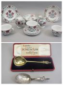 GILT SILVER CASED SPOON with card entitled 'Reproduction of the Celebrated St Nicholas spoon sold in