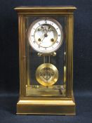 LEROY & FILS, PARIS BRASS & BEVELLED GLASS CASED MANTEL CLOCK, the dial set with Roman numerals,