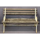 WOODEN SLATTED GARDEN BENCH with cast iron ends, 70cms H, 122cms W, 41cms seat D