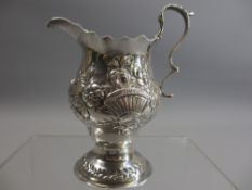 GEORGE III EMBOSSED SILVER CREAM JUG - London 1799, Maker William Kersill, 10.5cms overall H, 2.