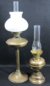 TWO BRASS BASED VINTAGE OIL LAMPS, the smaller converted for electricity, 70cms H the tallest