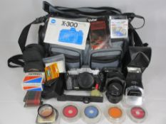 MINOLTA X-300 SLR CAMERA WITH VIVITAR FLASH - in a Guardsman Camera's carry case containing