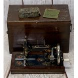 VINTAGE SAXONIA HAND CRANK SEWING MACHINE with decorative floral detail and original instructions,
