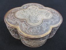 CHINESE GILT HIGHLIGHTED COPPER BOX - lobe form with raised floral panels to the top and sides and