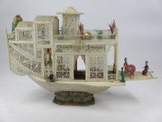 19TH CENTURY CHINESE PIERCED & CARVED BONE FLOWER BOAT - 26cms H, 40cms L (some damages and losses)