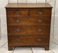 CIRCA 1860 OAK CHEST of two short over three long pine lined drawers, all having replacement oval