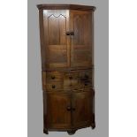 18th CENTURY CORNER CUPBOARD in three sections, the upper section having two fielded panelled