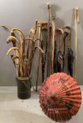 WALKING STICKS, UMBRELLAS, a large quantity in a large 'flask'