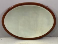 ANTIQUE MAHOGANY MIRROR - oval with bevelled glass and inlay detail, 95 x 73cms