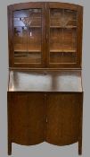 CIRCA 1930s BUREAU BOOKCASE having uppers Arts & Crafts style leaded glass doors, 187cms H, 93cms W,