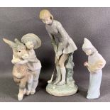 LLADRO - child hugging a mule, model J-24M, 21cms H, a young lady playing golf, model 1-2S, 28cms