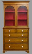 CIRCA 1900 BOOKCASE TOP CHEST, the upper section having arched glazed twin doors and the lower