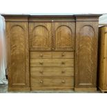 VICTORIAN MAHOGANY INVERTED BREAKFRONT COMBINATION WARDROBE with central drawer and slider section