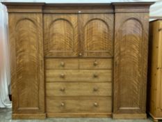 VICTORIAN MAHOGANY INVERTED BREAKFRONT COMBINATION WARDROBE with central drawer and slider section