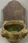 MORTAR SHAPE STONE PLANTER and a shaped top slab of slate, 26cms H, 53cms across and