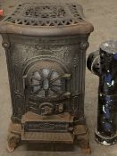 VINTAGE CAST IRON GAS STOVE with possibly associated flue attachments, 84cms H, 48cms W, 55cms D