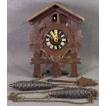 BLACK FOREST TYPE CUCKOO CLOCK with twin pine cone weights, 23 x 16cms