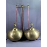 TABLE LAMPS - a pair of yellow metal bulbous lamps with shades, base diameter 28cms and a brass