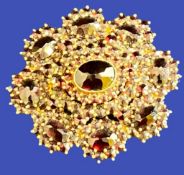 900 GOLD MARKED CIRCULAR GARNET BROOCH - 3.5cms diameter, 10.6grms total