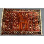 PERSIAN QASHQAI GABI HAND WOVEN IRANIAN RUG - red ground having a central pattern of a standing lion
