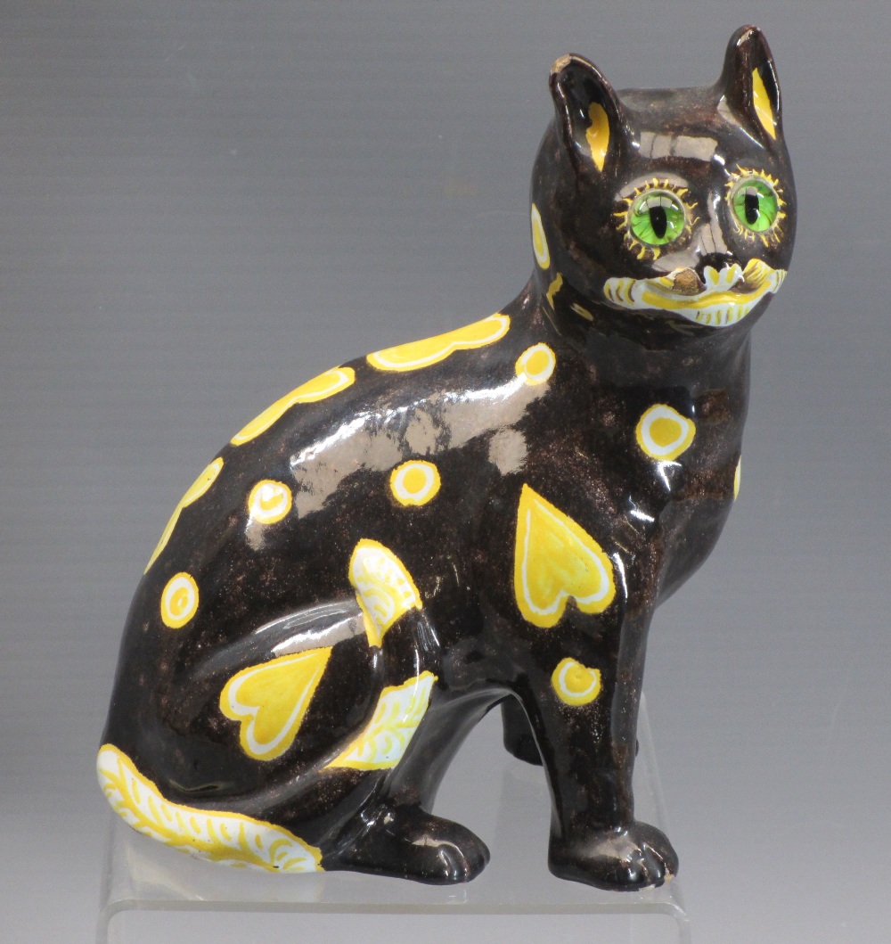 MOSANIC POTTERY CAT - in the style of Galle, mottled brown body with yellow hearts and spots and