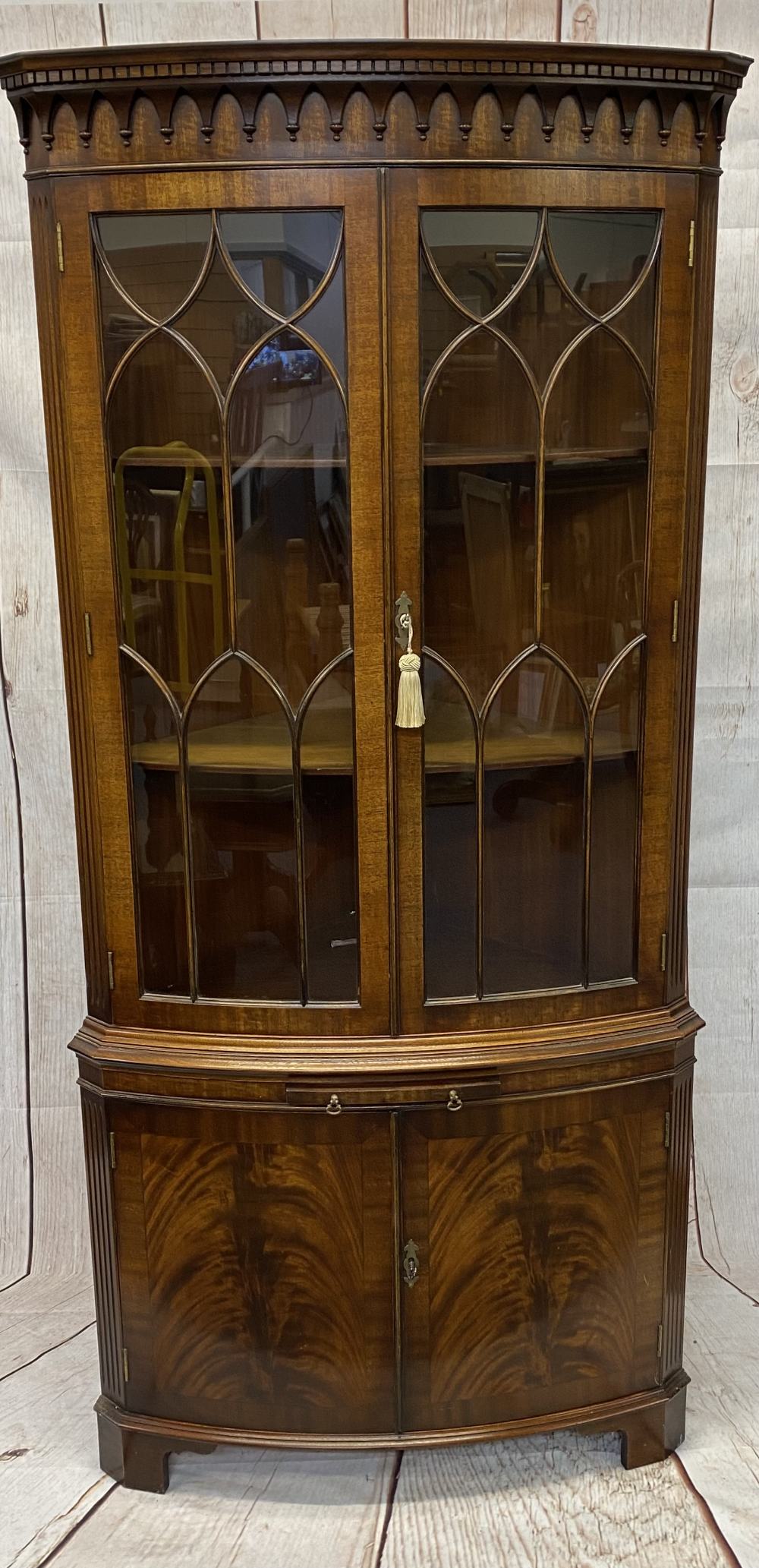 ELEGANT BOW FRONT CORNER DISPLAY CABINET - reproduction mahogany with twin underglaze doors, central