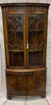 ELEGANT BOW FRONT CORNER DISPLAY CABINET - reproduction mahogany with twin underglaze doors, central