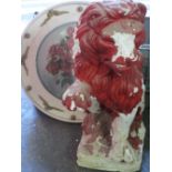 PLASTERWORK MODEL OF A SEATED LION, part painted red, 60cms H and a circular framed painting - Still