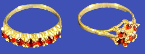 9CT GOLD GARNET SET DRESS RINGS (2) to include a seven stone inline example size Q, the other having