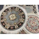 CHINESE WASHED RUGS (4) - two circular, 160cms diameter the largest and two oblong, 200 x 93cms