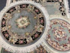 CHINESE WASHED RUGS (4) - two circular, 160cms diameter the largest and two oblong, 200 x 93cms