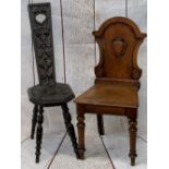 ANTIQUE MAHOGANY & OAK CHAIRS (2) - a mahogany shield back hall chair on turned front supports,