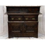 ANTIQUE & LATER CARVED OAK SIDEBOARD - the railback and extended top with edge carving and central