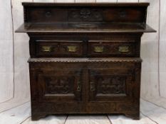 ANTIQUE & LATER CARVED OAK SIDEBOARD - the railback and extended top with edge carving and central