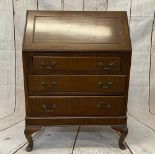 BUREAU - a reproduction mahogany example on pad feet, 104cms H, 74cms W, 44cms D