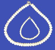 PEARL NECKLACE & BRACELET - a 40cms necklace of large uniform freshwater pearls, bracelet of small