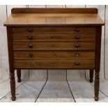 REGENCY STYLE MAHOGANY BEDROOM CHEST - of three drawers, having turned wooden knobs on carved reeded